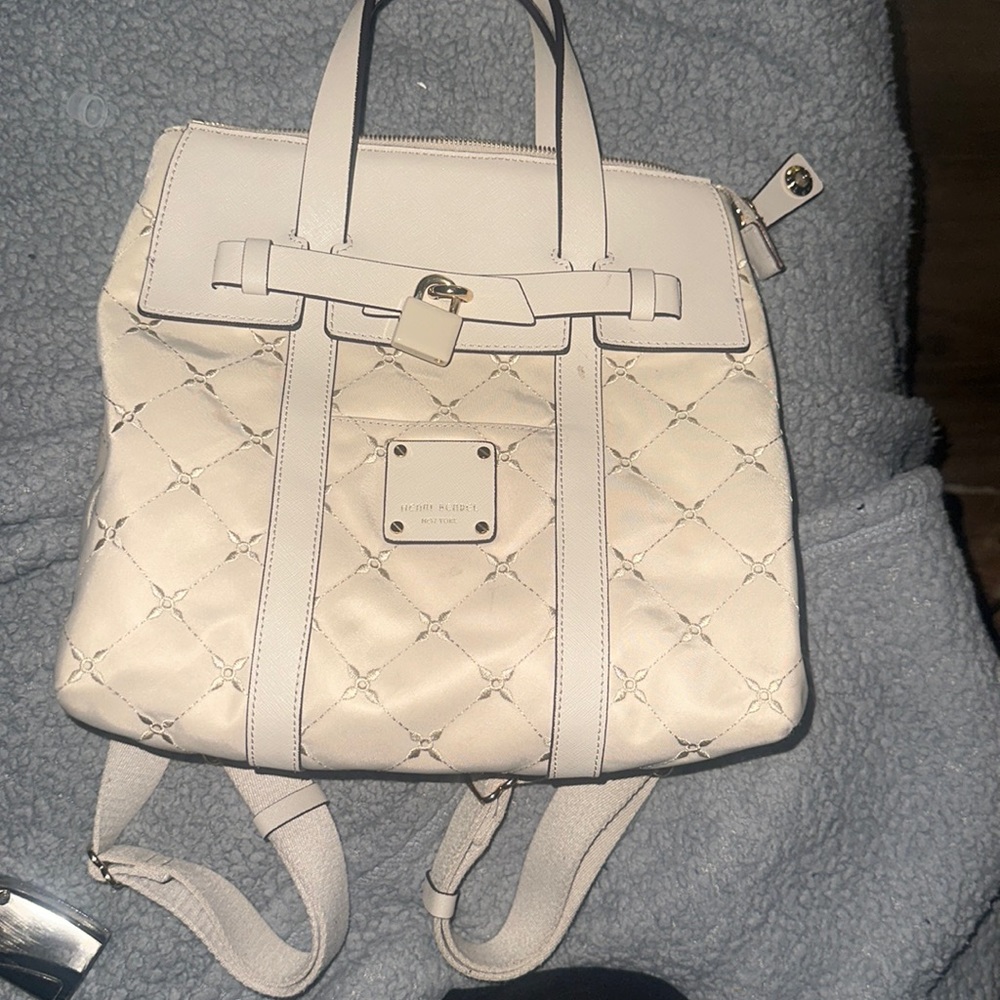Beautiful tan Henri Bendel convertable bag/mini backpack. gently used.